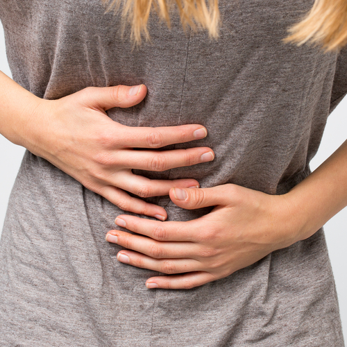 woman holding stomach