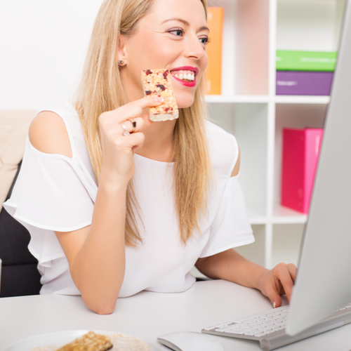 woman eating breakfast bar