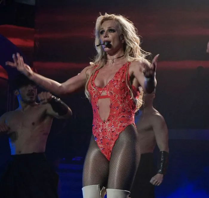 Britney Spears performing on stage during a concert.