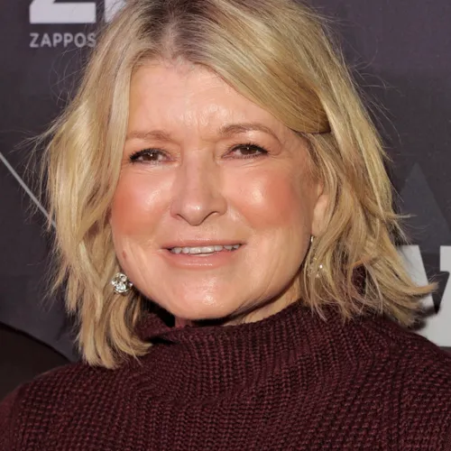 Martha Stewart posing elegantly in a fashionable outfit.