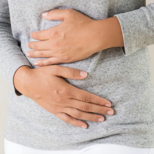 woman holding stomach