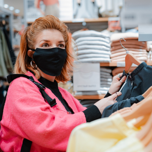 woman in mask shopping