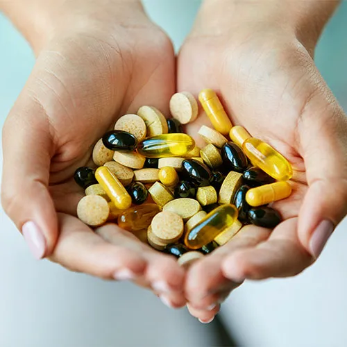 vitamins in hands
