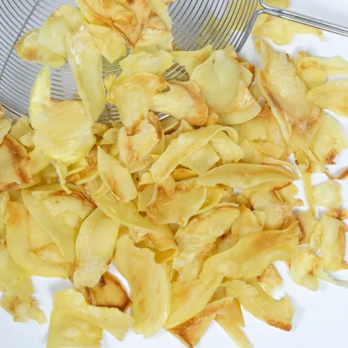 Crunchy fruit chips arranged in a colorful bowl.