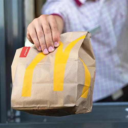 Tasty McDonald's burger and fries showcased in a promotional slide.