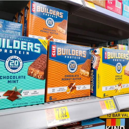 Assorted protein bars in different flavors on display.