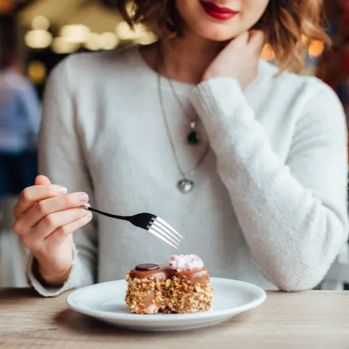 woman eating dessert