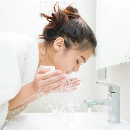 woman washing face