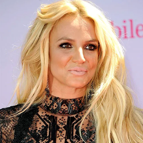 Britney Spears performing on stage in glamorous outfit
