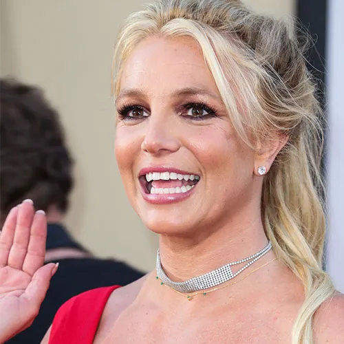 Britney Spears posing for a photoshoot in elegant attire