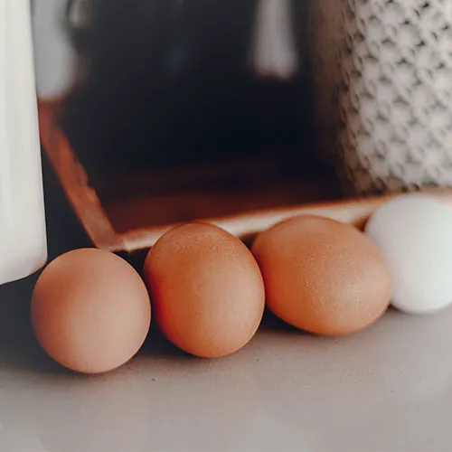 Freshly laid eggs in a rustic basket