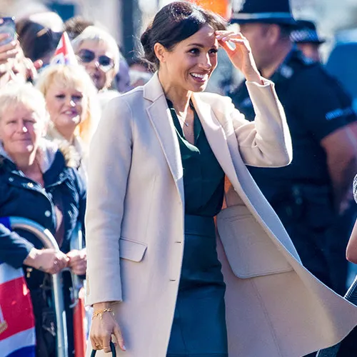 Meghan Markle attending an event, radiating grace and style.