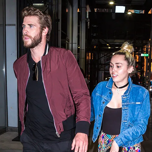 Miley Cyrus and Liam Hemsworth at a red carpet event
