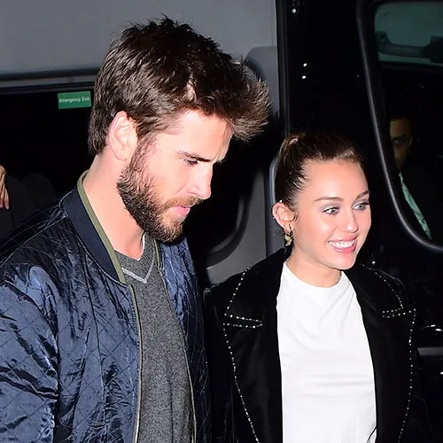 Miley Cyrus and Liam Hemsworth sharing a candid moment