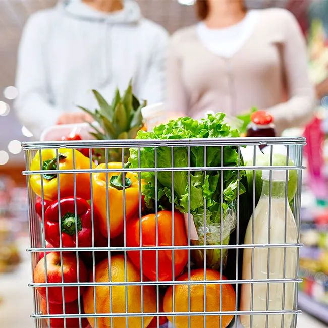 Top view of groceries in a shopping cart.