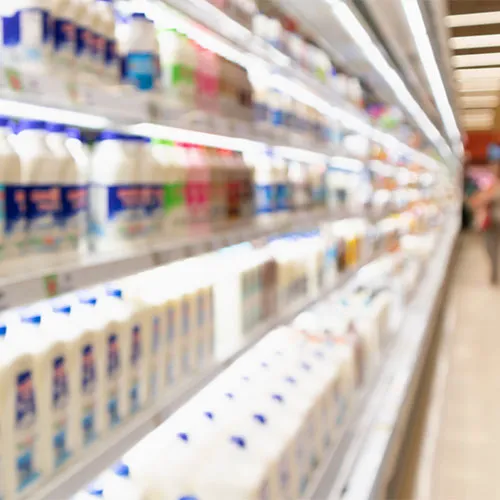 Dairy products displayed in a grocery store section