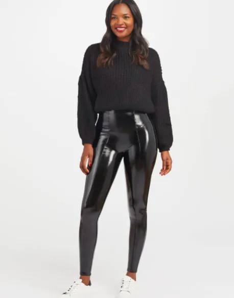 Close-up of faux patent leather leggings in a chic setting.