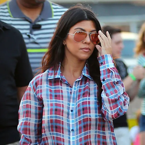 "Kourtney Kardashian having fun ice skating"