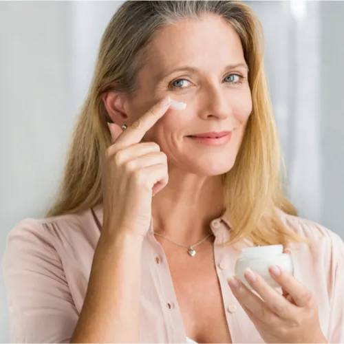 woman applying cream