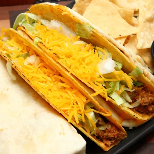 Crunchy Taco Bell taco with fresh ingredients and flavors.