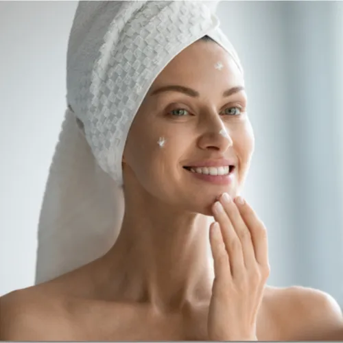 woman applying wrinkle cream