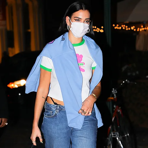 Dua Lipa showcasing her fashion style