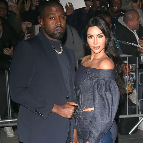 "Kim Kardashian posing on the red carpet"
