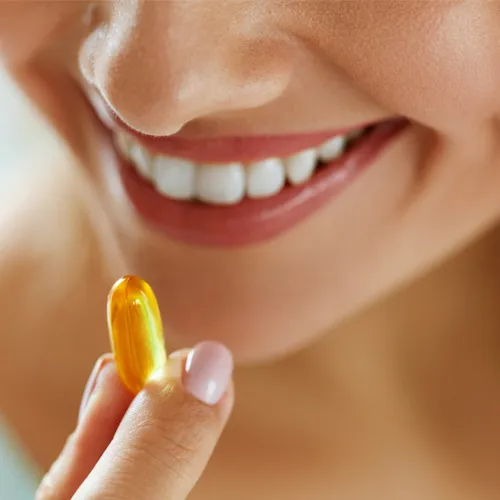 woman taking supplement