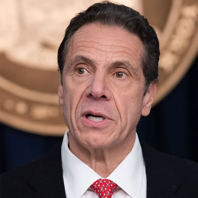 Andrew Cuomo speaking at a press conference event.