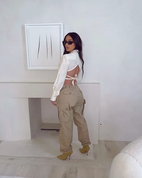 Beyoncé and Kim Kardashian showcasing their stylish outfits.