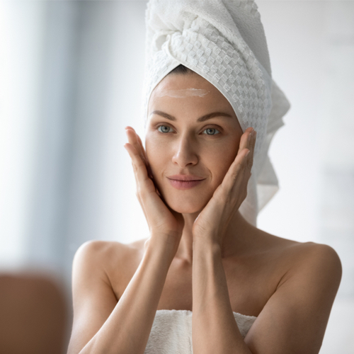 woman applying skincare