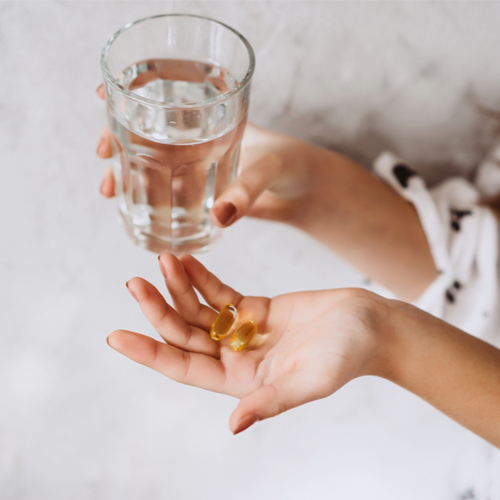 woman taking pill