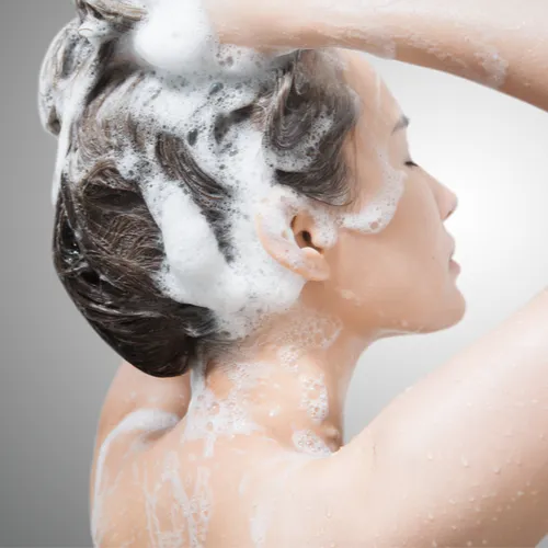 Close-up of a luxurious skincare product with floral background.