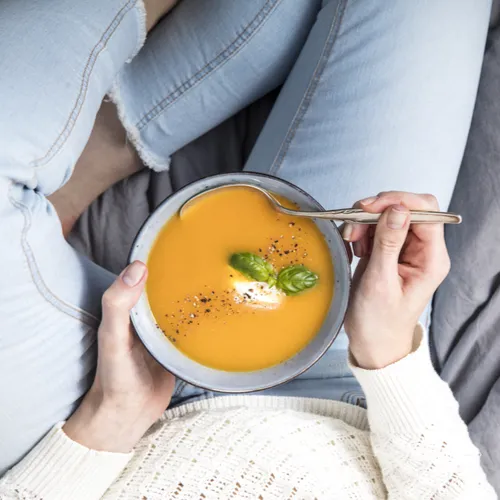 woman eating soup