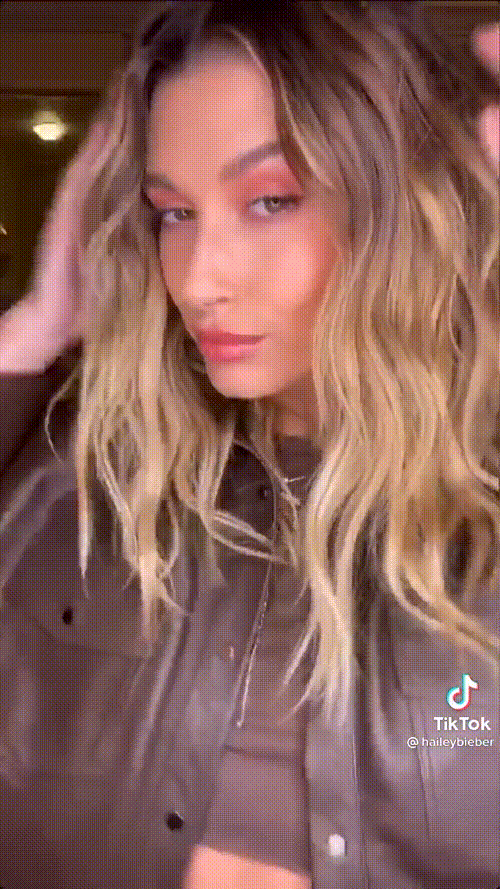 Hailey Bieber showcasing elegant style in a glamorous photoshoot.