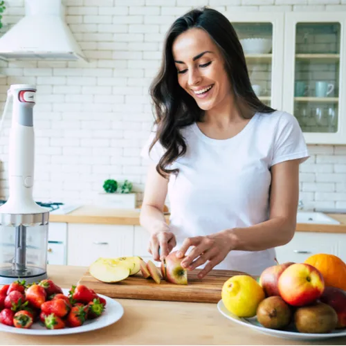 woman cutting fruit