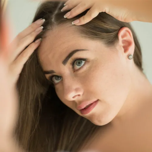 woman checking hair
