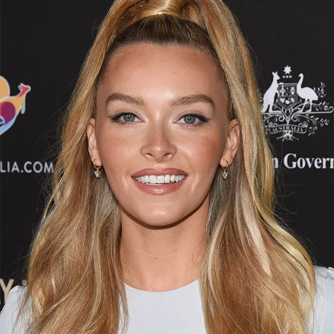 Camille Kostek with a stylish high ponytail hairstyle.