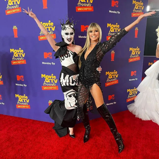 "Heidi Klum at the MTV Movie Awards in a sheer black dress"