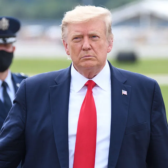 Donald Trump wearing a red tie during an appearance.