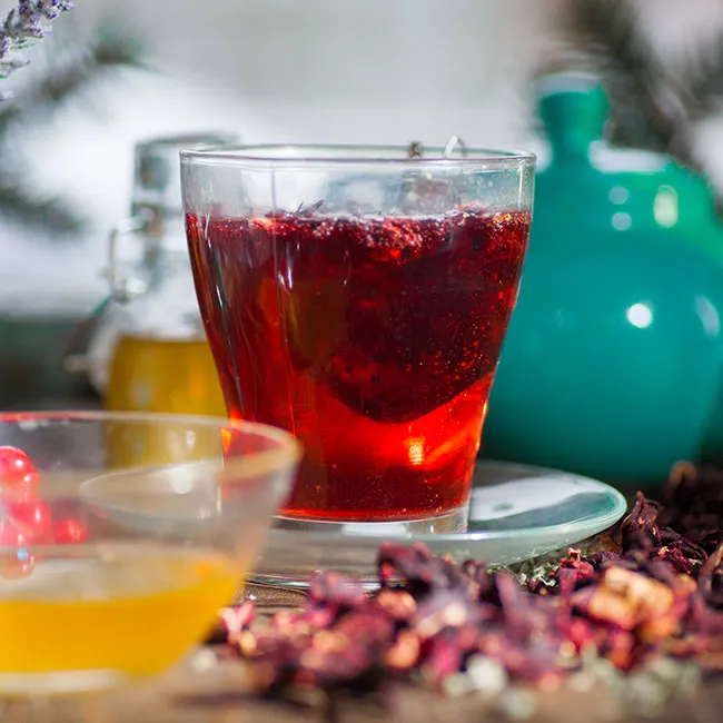 Herbal hibiscus tea brewed in a teapot.