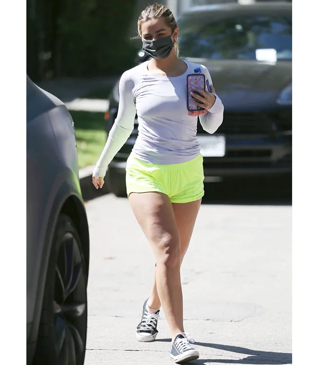 Addison Rae in Lululemon shorts showcasing casual style.