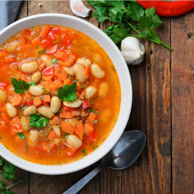 Creamy white bean stew with herbs and vegetables