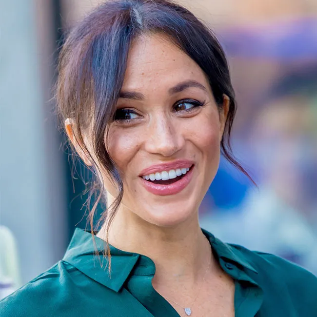 Meghan Markle attending a public event with poise and elegance.
