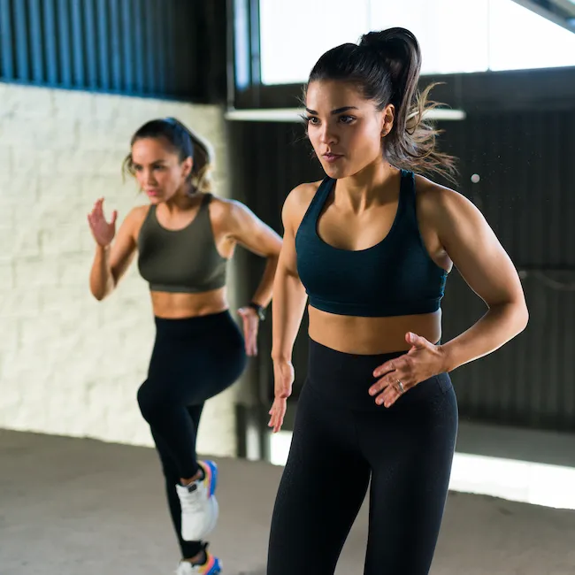 "Woman lifting heavy weights"