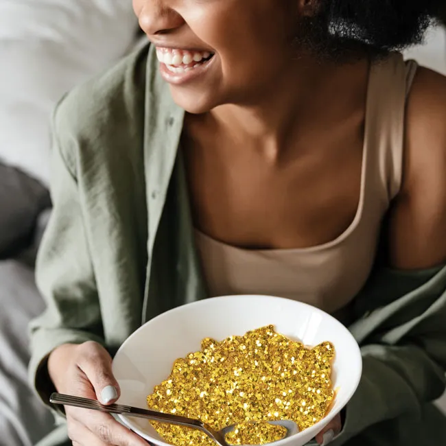"Woman enjoying a meal from a bowl"