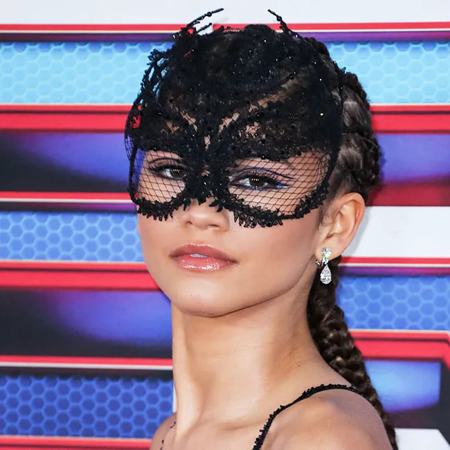 Zendaya striking a pose at a celebrity event.