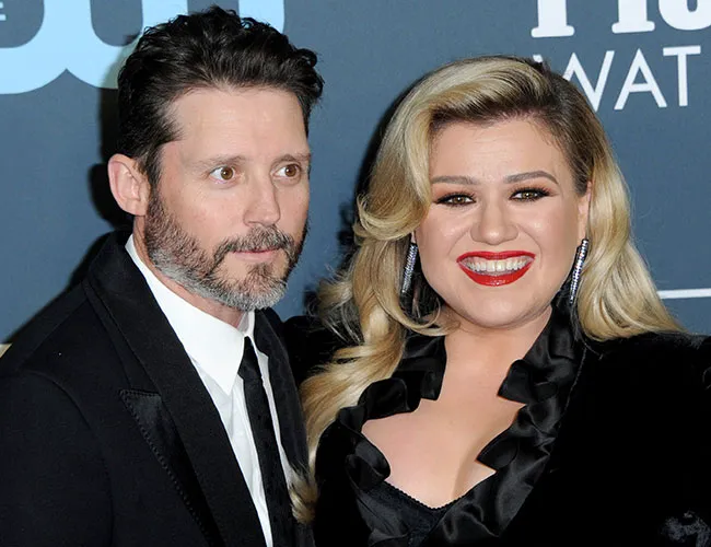 Kelly Clarkson with Brandon Blackstock at a public event.