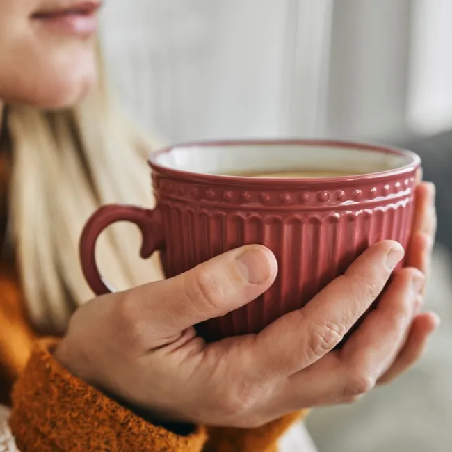 Cozy mug of drink representing relaxation and beauty rituals.
