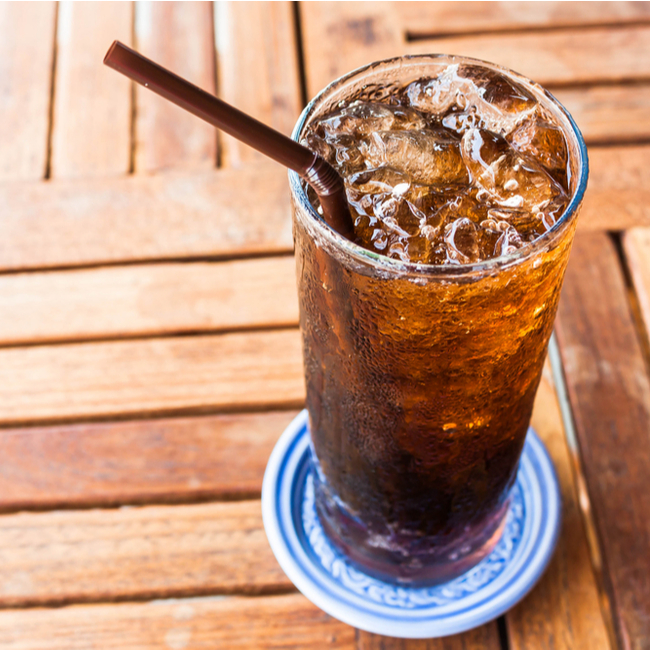 glass of cola with straw